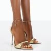 Triumph Wide Fit Gold PU Lock Chain Detail Stiletto Heels 1 Triumph Wide Fit Gold PU Lock Chain Detail Stiletto Heels -Chic Footwear Shop 00062 f32f61a9 cfd1 42c2 ab4e 4a164d711fa0