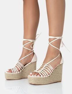 Reece Wide Fit Ecru Pu Knot Strap Lace Up Raffia Wedge Heels 8 Reece Wide Fit Ecru Pu Knot Strap Lace Up Raffia Wedge Heels -Chic Footwear Shop 771A3450