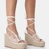Reece Wide Fit Ecru Pu Knot Strap Lace Up Raffia Wedge Heels 1 Reece Wide Fit Ecru Pu Knot Strap Lace Up Raffia Wedge Heels -Chic Footwear Shop 771A3453 d488a30c 5e67 420b a6c3 c2ba662d2e09